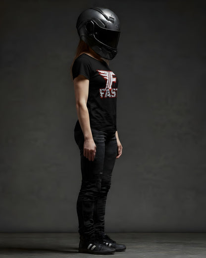 A woman in a black superbike t-shirt, jeans, and a dark motorcycle helmet stands against a gray background. This art shirt is perfect for motorcycle enthusiast apparel.