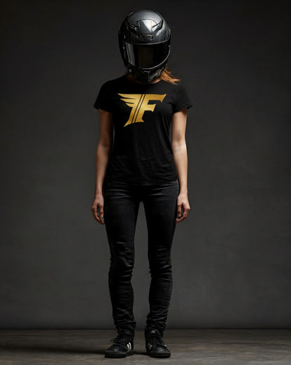 Person wearing a black t-shirt with a gold logo and a black helmet on a dark background