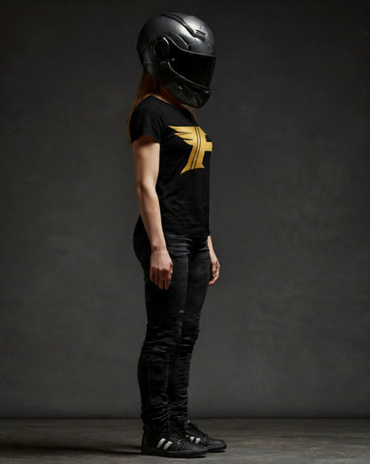 Person wearing a black helmet and black t-shirt with a yellow logo against a dark background