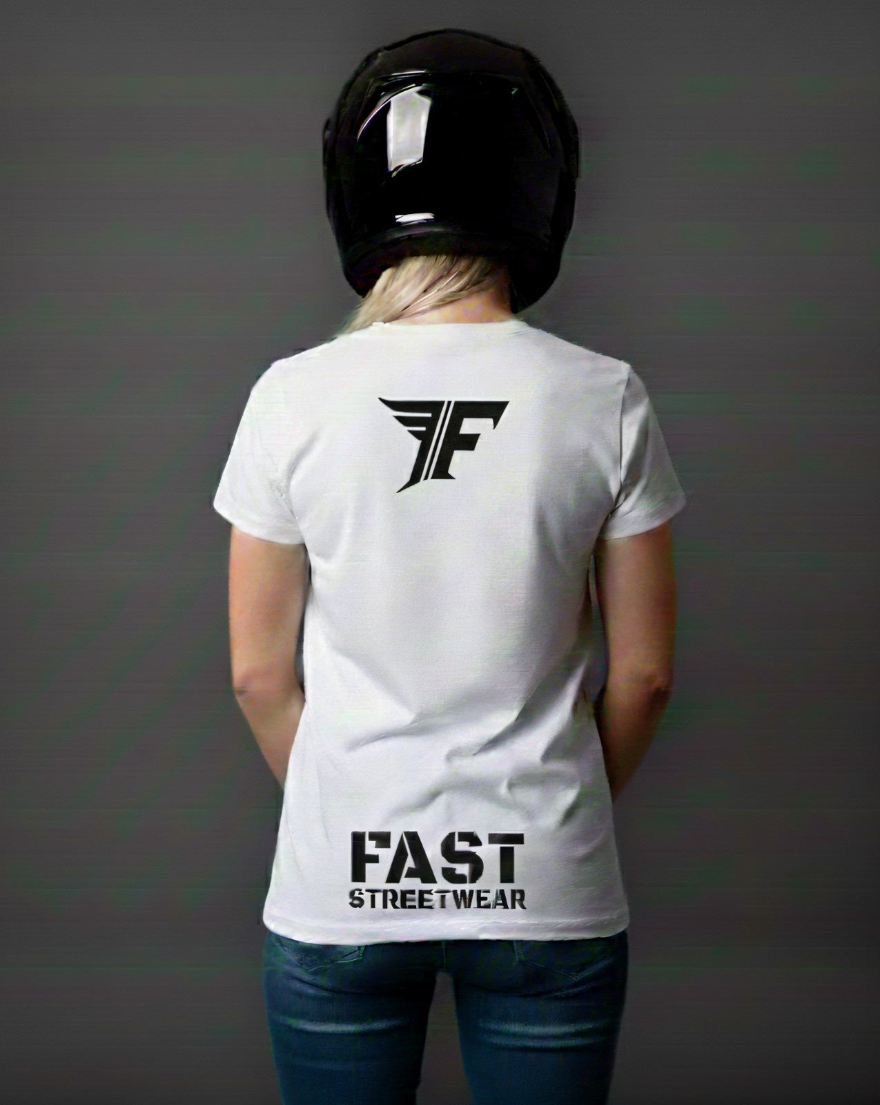 Person wearing a black t-shirt with 'FAST STREETWEAR' logo and text, standing against a gray background.