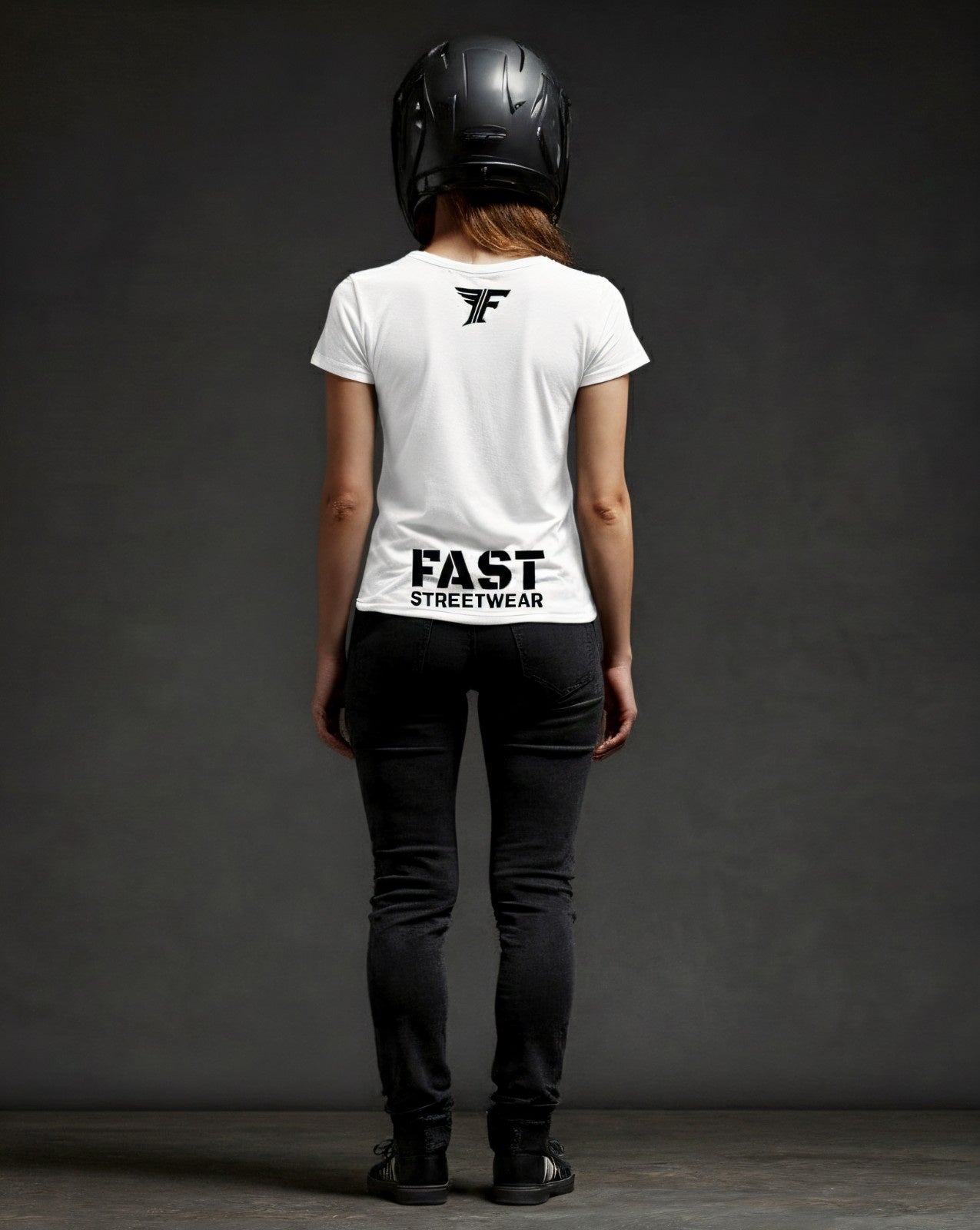 Person wearing a white t-shirt with 'FAST STREETWEAR' text and logo, black helmet, and black pants on a dark background.