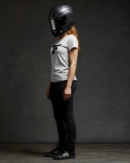 Person wearing a black helmet and white t-shirt with a logo on a dark background