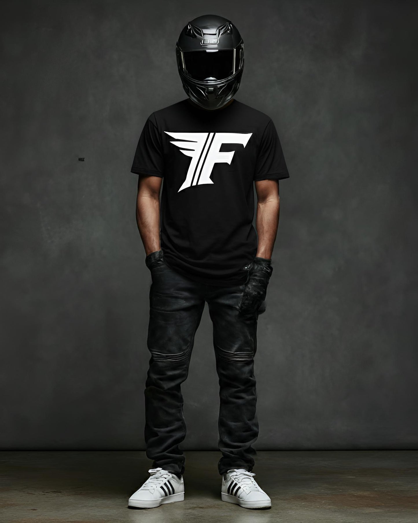 Person wearing a black t-shirt with a logo, black helmet, leather pants, and white sneakers on a dark background