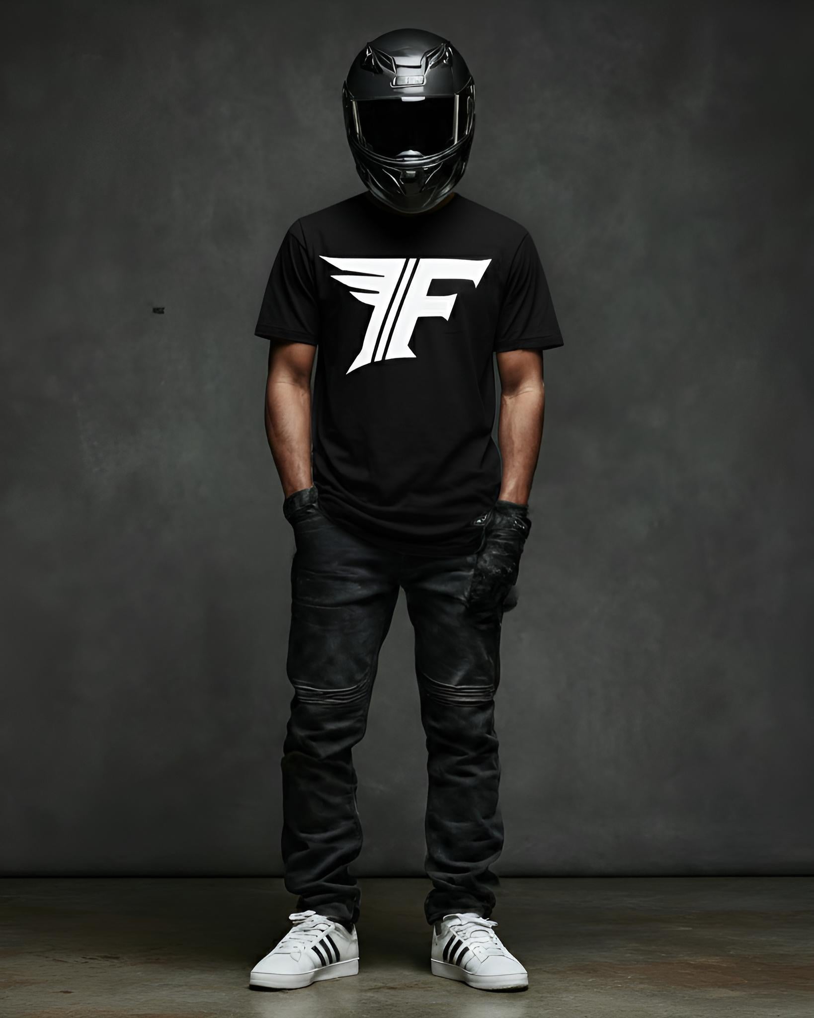 Person wearing a black t-shirt with a logo, black helmet, leather pants, and white sneakers on a dark background