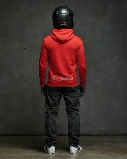 Person wearing a red hoodie with 'Fast Streetwear' text, black helmet, and dark pants against a gray background.
