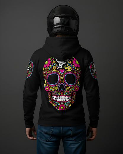 Back view of black hoodie with an oversized, multi-colored sugar skull graphic covering the entire back. Model wears a carbon fiber motorcycle helmet.