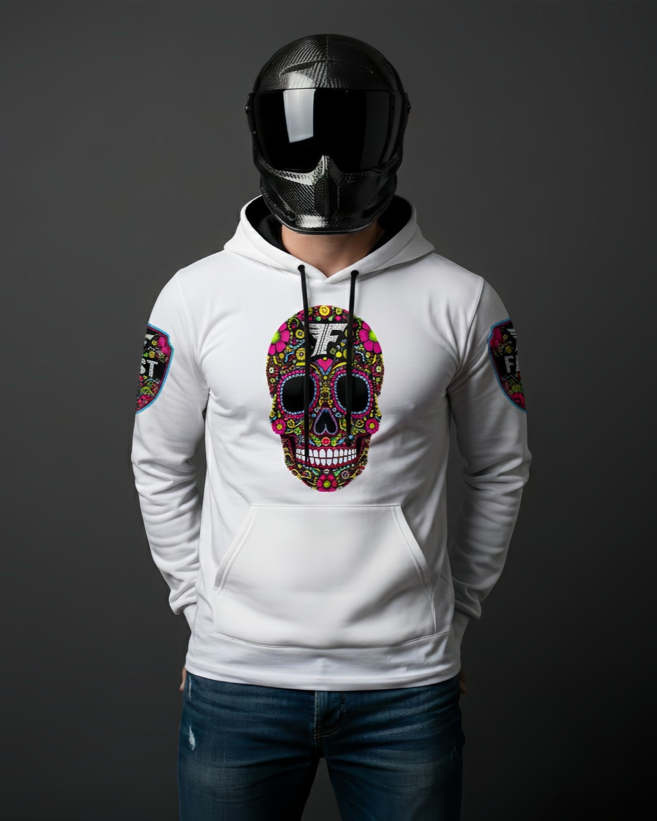 White hoodie featuring a large, brightly colored Day of the Dead sugar skull design on the chest, worn by a person in a carbon fiber motorcycle helmet.