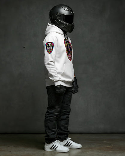 Right side profile of the white sugar skull hoodie, featuring the colorful sleeve patch detail. Model wearing a black helmet and gloves.