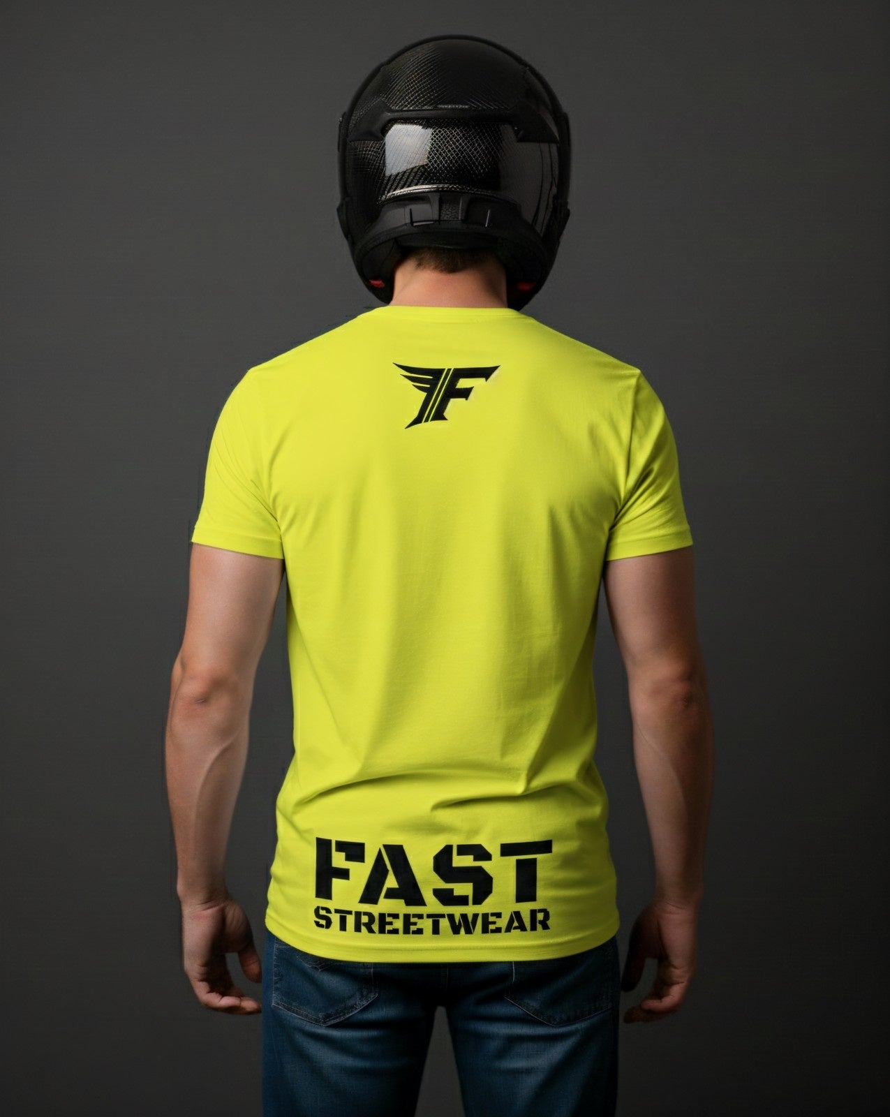 A man in a black helmet wears a fluorescent yellow T-shirt with a black "F" logo on the upper back and the text "FAST STREETWEAR" near the bottom.