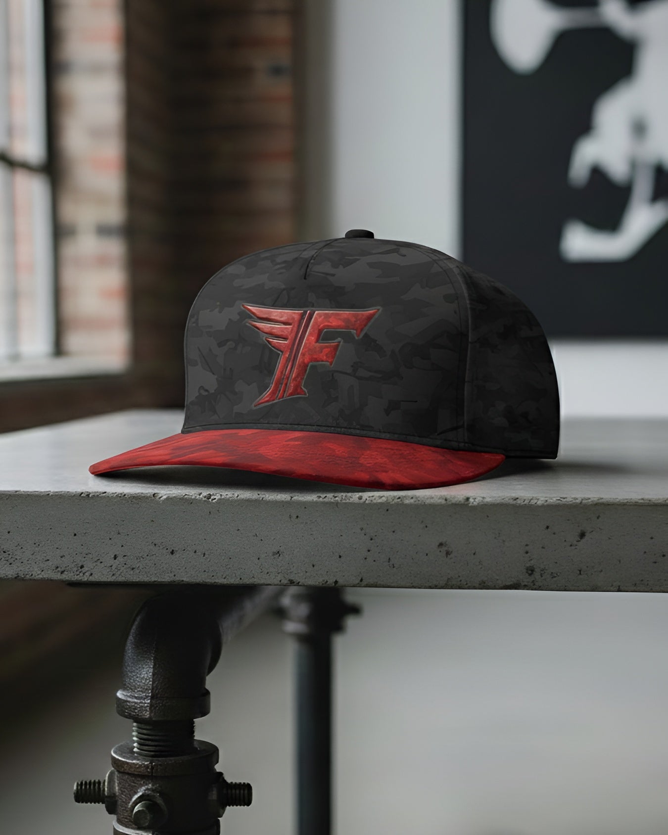 Black and red cap with a logo on a concrete surface